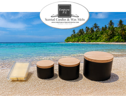 Black scented candle jars with wood lids and wax melts on tropical beach with ocean view
